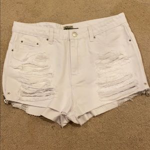 White ripped jean shorts